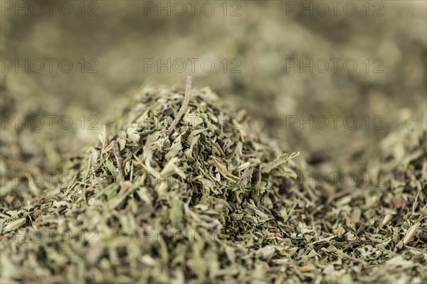 Stevia leaves (dried) for use as background image or as texture (close-up shot, selective focus)