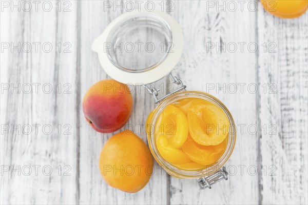 Pickled Apricots on a vintage background as detailed close-up shot (selective focus)