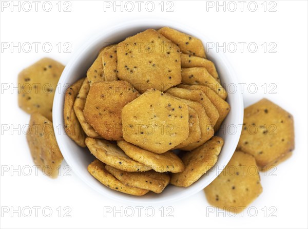 Portion of mixed Snacks isolated on white background (detailed close up shot, selective focus)