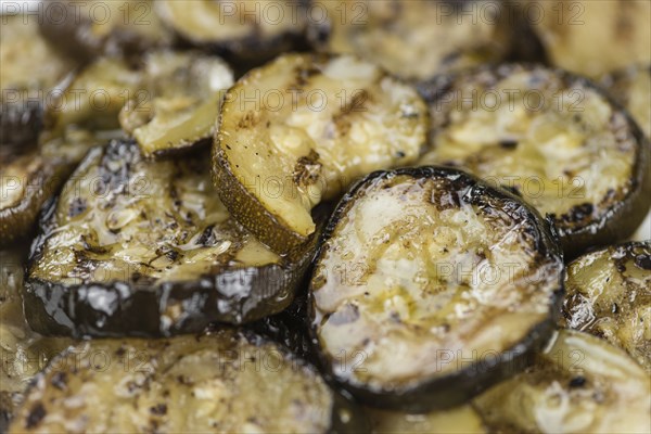 Grilled Zucchinis on a vintage background as detailed close-up shot (selective focus)