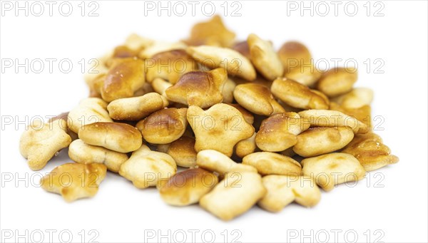 Portion of mixed Snacks isolated on white background (detailed close up shot, selective focus)
