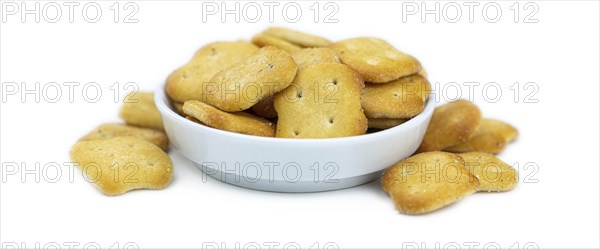 Portion of mixed Snacks isolated on white background (detailed close up shot, selective focus)