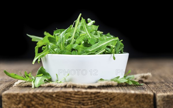 Portion of fresh Arugula (detailed close-up shot, selective focus)