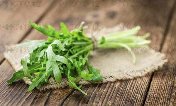 Portion of fresh Arugula (detailed close-up shot, selective focus)
