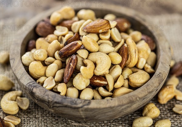 Roasted and salted nuts as detailed close up shot (selective focus)