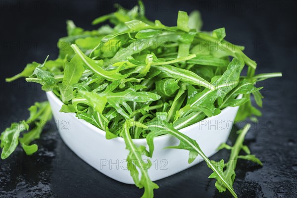 Portion of fresh Arugula (detailed close-up shot, selective focus)