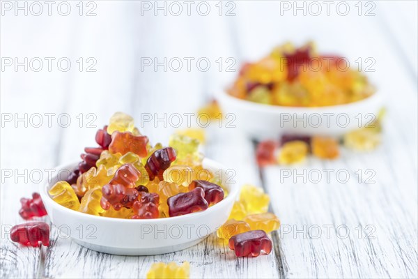 Fruity Gummy Bears (close-up shot) on an old wooden table