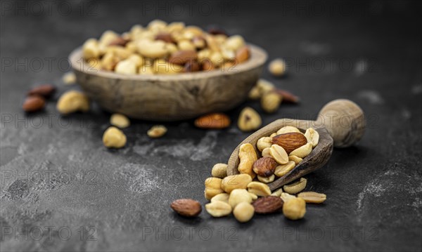 Roasted and salted nuts as detailed close up shot (selective focus)