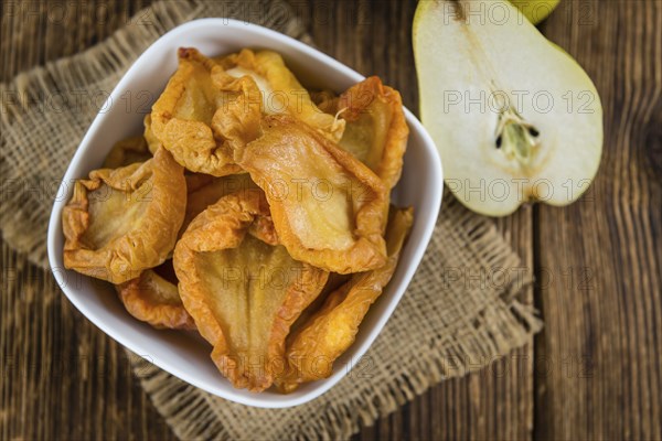 Bowl with dried Pears (close-up shot, selective focus)