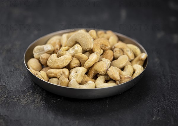 Portion of Cashew Nuts (close up shot, selective focus)