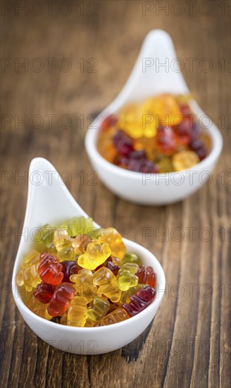 Fruity Gummy Bears (close-up shot) on an old wooden table