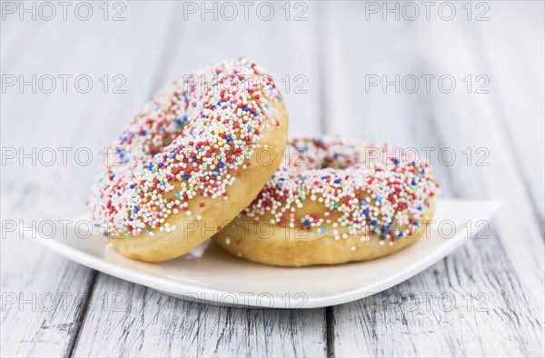 Portion of some Donuts as detailed close-up shot (fresh made, selective focus)