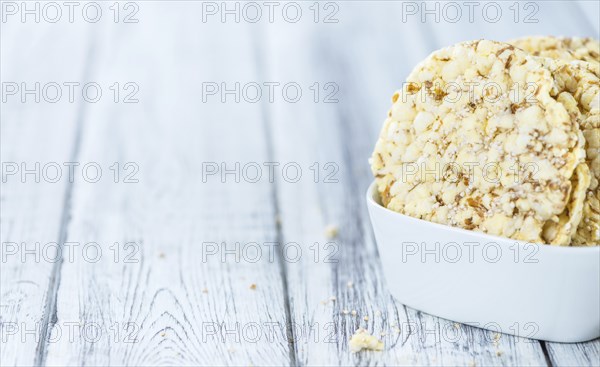 Fresh made Corn Waffles (close-up shot, selective focus) on vintage wooden background