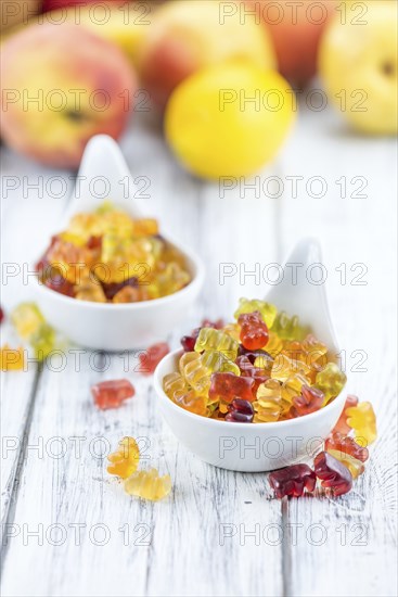 Fruity Gummy Bears (close-up shot) on an old wooden table