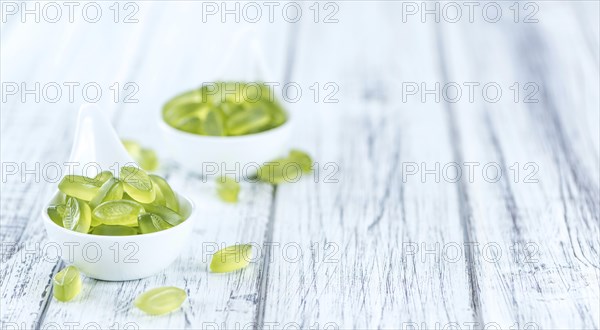 Portion of gummy candy (with lime taste) as close-up shot (selective focus)
