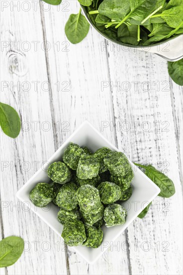Frozen spinach cubes as detailed close up shot (selective focus)