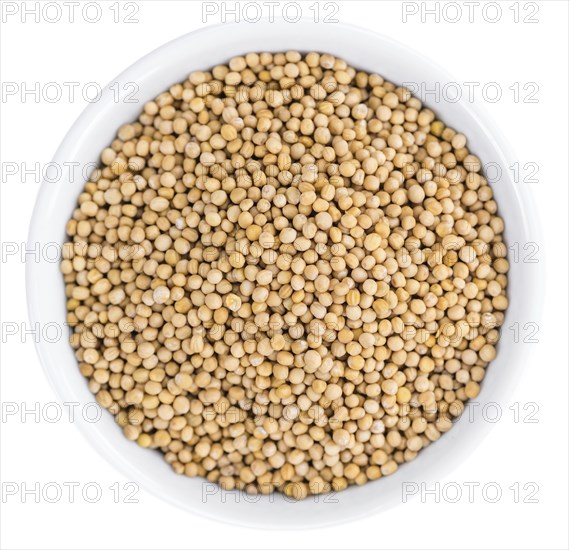 Mustard Seeds isolated on white background (selective focus, close-up shot)