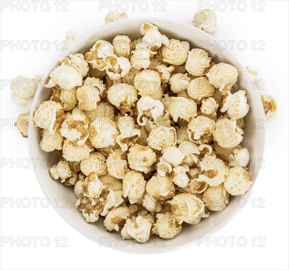 Portion of Popcorn as detailed close-up shot isolated on white background