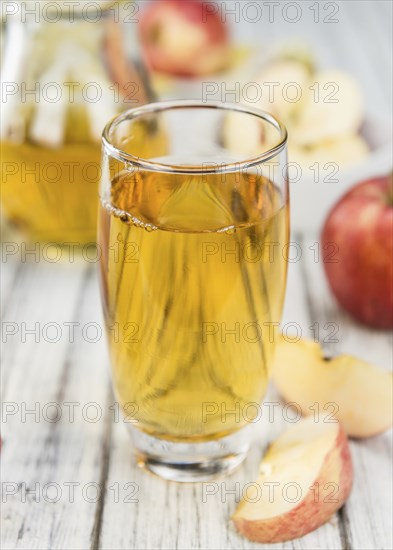 Apple Cider on a vintage background as detailed close-up shot (selective focus)