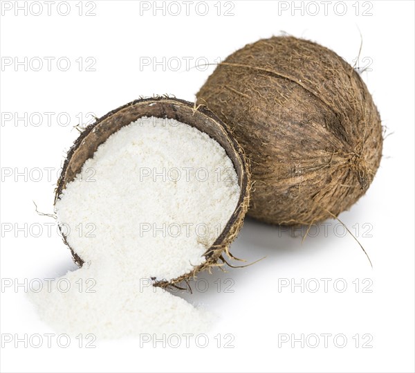 Coconut flour as detailed close-up shot isolated on white background (selective focus)