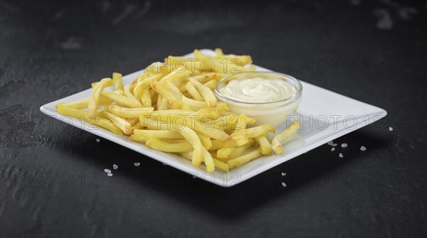 Portion of fresh made French Fries (close-up shot, selective focus)