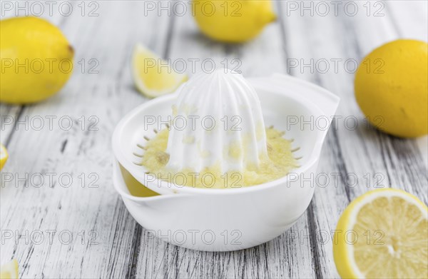 Fresh made Juice (lemon) on a vintage background (close-up shot)
