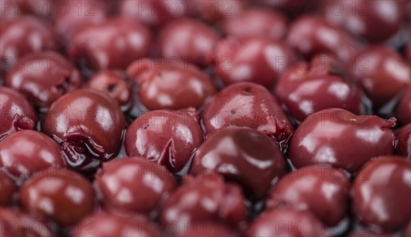 Preserved Cherries on a vintage background as detailed close-up shot, selective focus