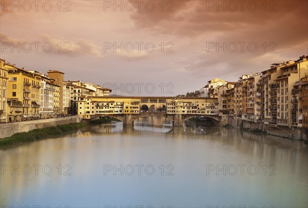 Far view at sunset of Ponte Vecchio in Florence, Italy, Europe