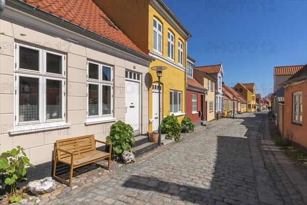 Old town of Rudkobing, renovated houses, colourful row of houses, dormers, lantern, decorative