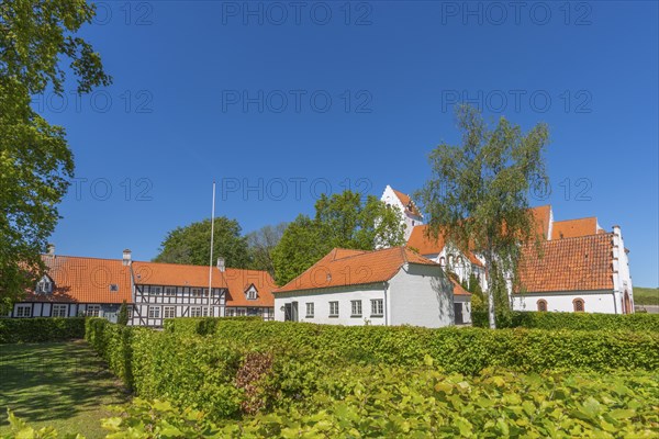 Lindelse Kirke, typical Danish church from 1830, whitewashed, red tiled roof, hill, pastorate,