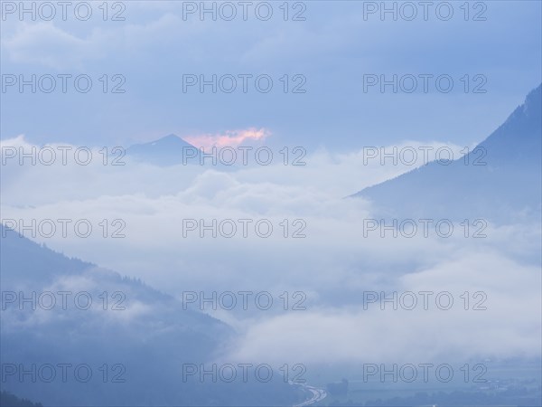 Evening clouds and fog over the Liesingtal, in the valley the village of Traboch, Schoberpass