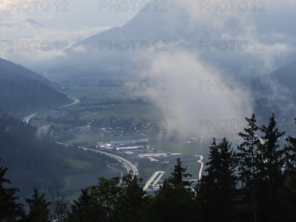 Evening clouds and fog over the Liesingtal, in the valley the village of Traboch, Schoberpass