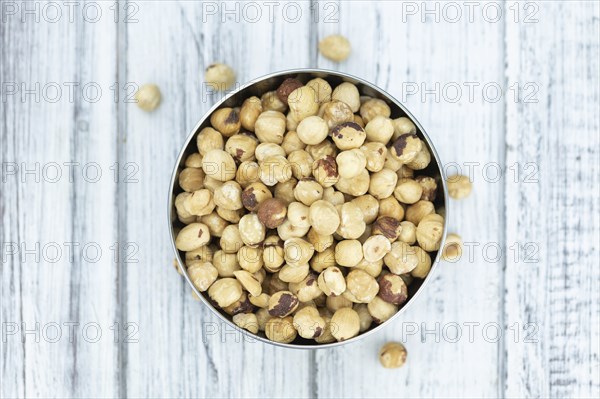 Peeled Hazelnuts as detailed close up shot (selective focus)