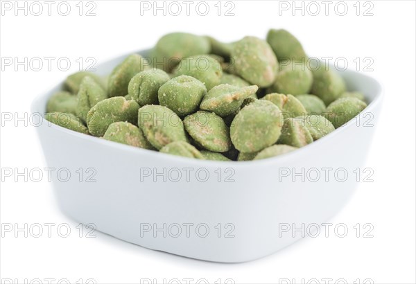 Peanuts (with Wasabi flavor) isolated on white background (selective focus, close-up shot)