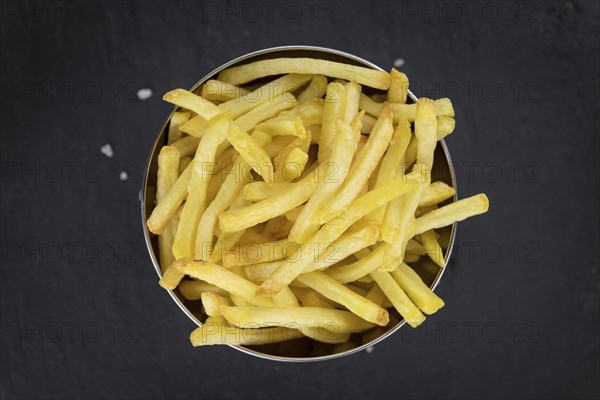 Portion of homemade French Fries (close-up shot, selective focus)