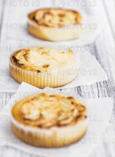 Homemade Cheesecake on an wooden table (selective focus) as detailed close-up shot