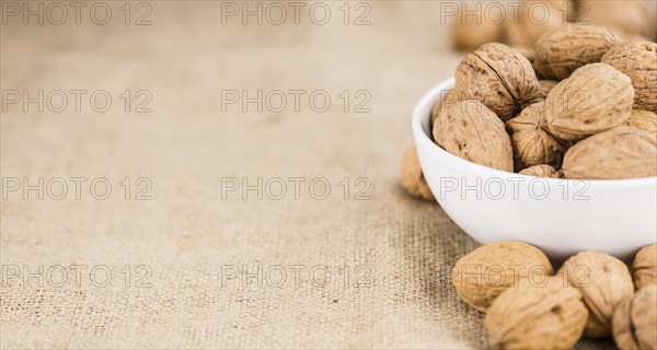 Walnuts on a vintage background as detailed close-up shot (selective focus)
