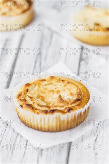 Homemade Cheesecake on vintage background (selective focus, close-up shot)