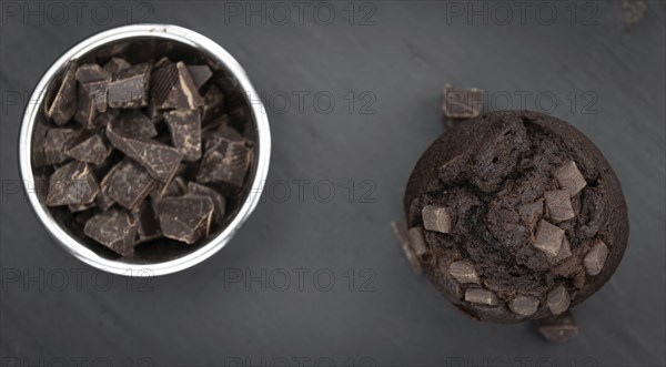 Portion of healthy Chocolate Muffins on a slate slab (selective focus)