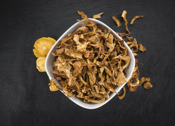 Fresh made Dried Chanterelles on a vintage background as detailed close-up shot