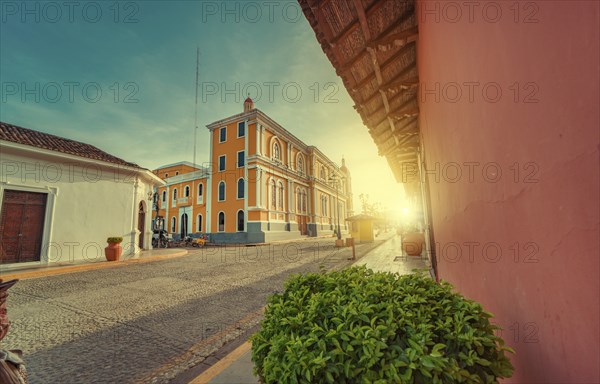 View of the street of the cathedral of Granada Nicaragua leading to La Calzada at sunset