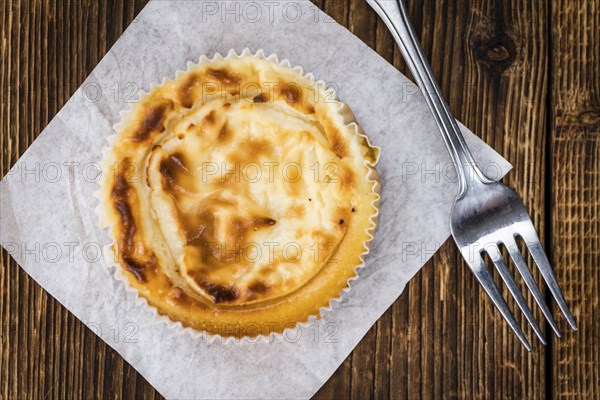 Homemade Cheesecake on vintage background (selective focus, close-up shot)