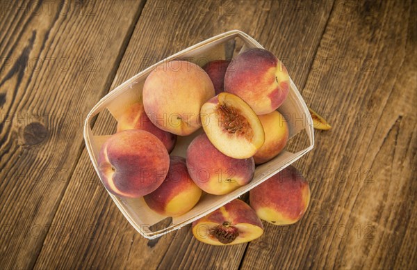 Portion of fresh Peaches close-up shot, selective focus