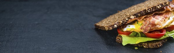 Fresh made Bacon and Egg Sandwich (selective focus, close-up shot)