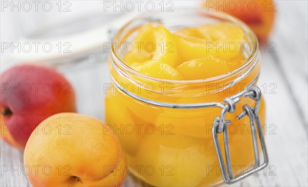 Pickled Apricots on a vintage background as detailed close-up shot (selective focus)