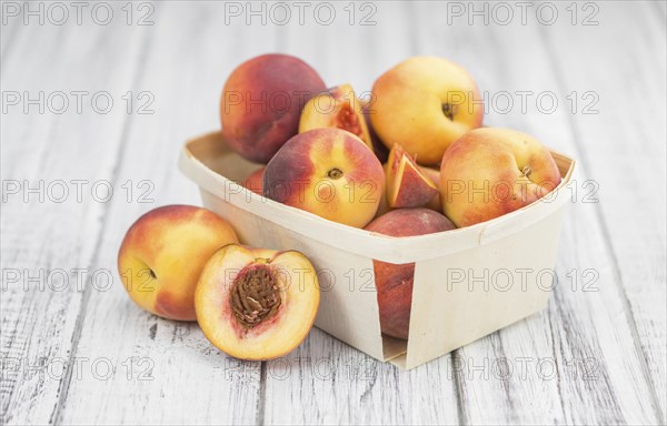 Peaches on a vintage background as detailed close-up shot, selective focus