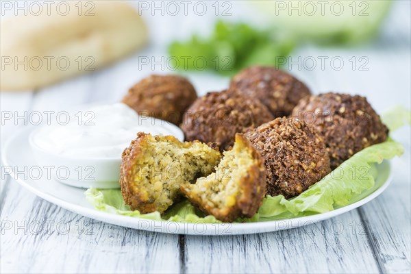 Wooden table with Falafels (close-up shot, selective focus)