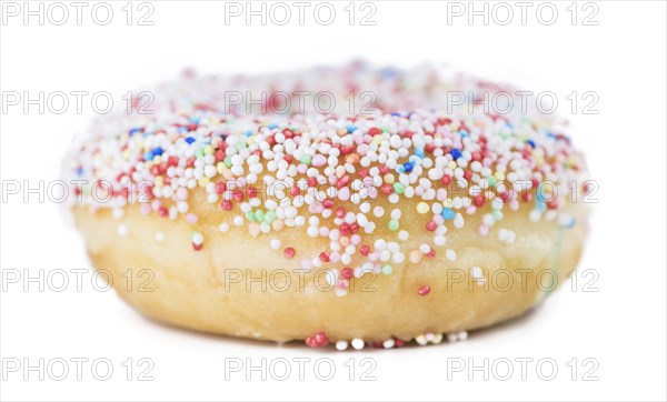 Some fresh made Donuts isolated on white background (close-up shot)