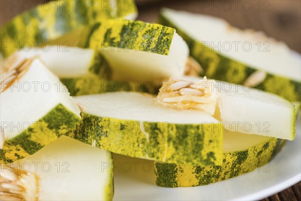 Portion of fresh Futuro Melons (close-up shot, selective focus)