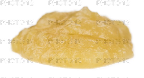 Homemade Applesauce (selective focus) isolated on white background (close-up shot)